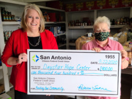 SACFCU's president - Patty Sarne presenting a check for $1,400 to Daystar Hope Center