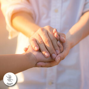 Helping hands. Logo located on the bottom left has a hand giving change with text reading "CHARITY".