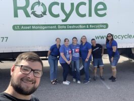 Team standing in front of Rocycle truck